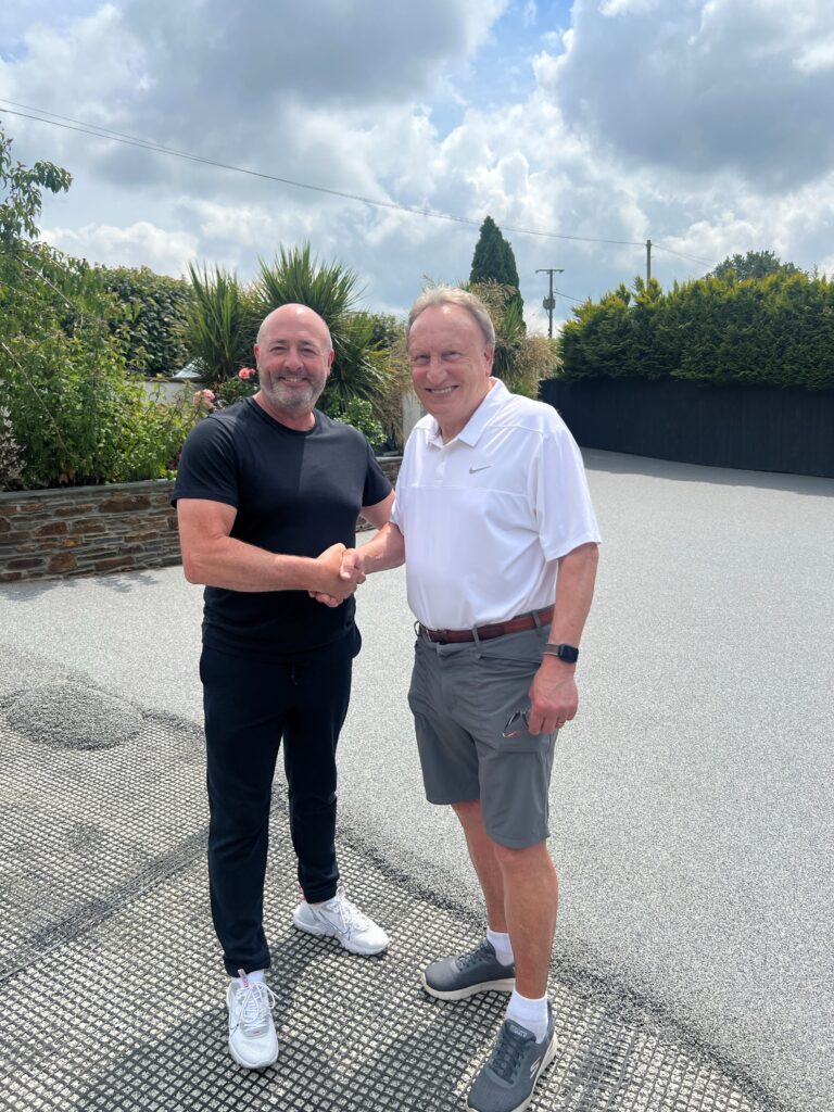 Neil Warnock and Jason shaking hands on Neils new driveway