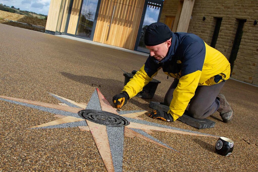 Finishing touches being applied to the resin bound surface